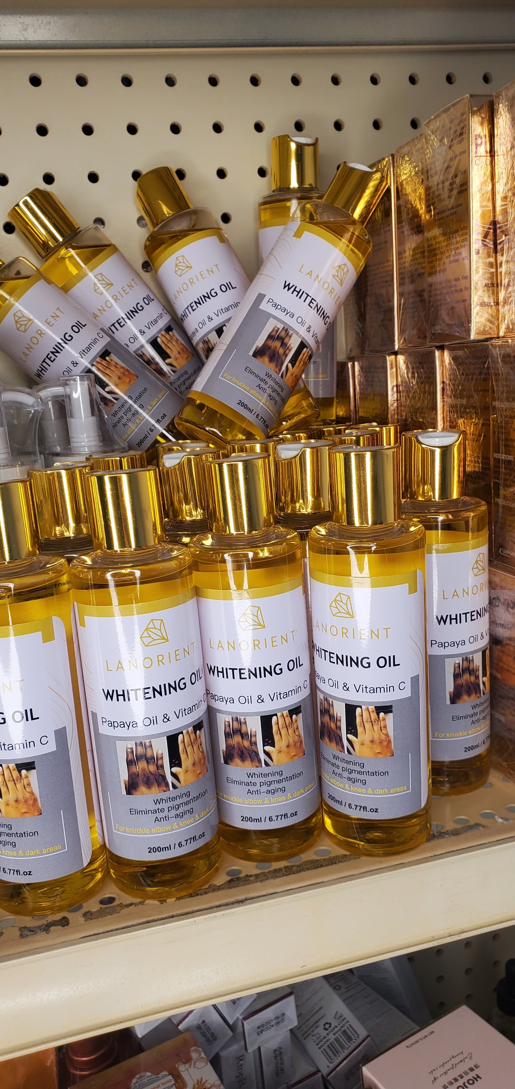 Whitening Oil with papaya and vitamin c for dark spots, knuckle,dull skin .